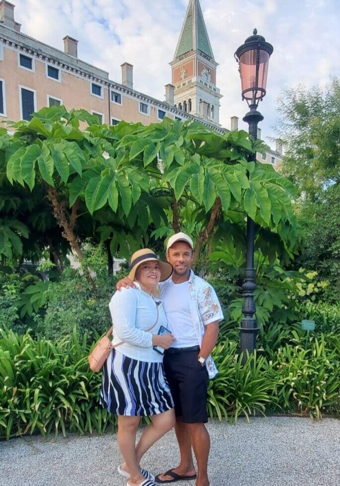 A man and woman standing next to each other.